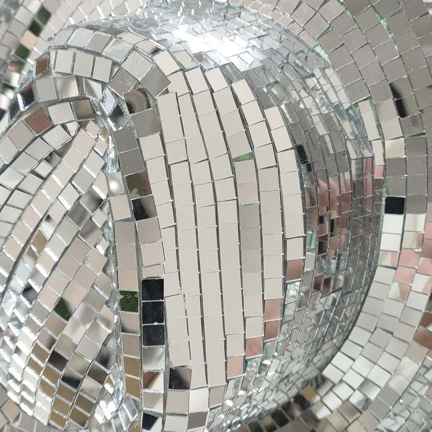 Close-up of the mirror surface on a silver disco cowboy hat